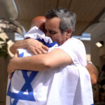 Released Israeli hostage, Omri Miran, held in Gaza since the deadly October 7, 2023 attack by Hamas, embraces his father, Dani Miran, after his release as part of a prisoner-hostage swap and a ceasefire deal between Israel and Hamas, in Reim, Israel October 13, 2025. Israel Defense Forces/Handout via REUTERS THIS IMAGE HAS BEEN SUPPLIED BY A THIRD PARTY
