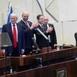 President Donald Trump arrives with Knesset Speaker Amir Ohana and Israel's President Isaac Herzog to speak to the Knesset, Israel's parliament, Monday, Oct. 13, 2025, in Jerusalem. Evan Vucci/Pool via REUTERS