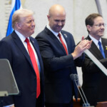 President Donald Trump arrives with Knesset Speaker Amir Ohana and Israel's President Isaac Herzog to speak to the Knesset, Israel's parliament, Monday, Oct. 13, 2025, in Jerusalem. Evan Vucci/Pool via REUTERS