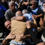 A freed Palestinian prisoner meets his family members after being released from an Israeli jail as part of a hostages-prisoners swap and a ceasefire deal in Gaza between Hamas and Israel, in Ramallah, in the Israeli-occupied West Bank, October 13, 2025. REUTERS/Mussa Qawasma