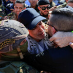 A freed Palestinian prisoner hugs his family member after being released from an Israeli jail as part of a hostages-prisoners swap and a ceasefire deal in Gaza between Hamas and Israel, in Ramallah, in the Israeli-occupied West Bank, October 13, 2025. REUTERS/Mussa Qawasma