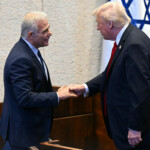 US President Donald Trump (R) shakes hands with Israeli opposition leader and lawmaker Yair Lapid at the Israeli parliament, the Knesset, in Jerusalem on October 13, 2025. SAUL LOEB/Pool via REUTERS