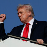 U.S. President Donald Trump gestures as he boards Air Force One en route to Sharm El-Sheikh, Egypt, to attend a world leaders' summit on ending the Gaza war, amid a U.S.-brokered prisoner-hostage swap and ceasefire deal between Israel and Hamas, at Ben Gurion International Airport in Lod, Israel, October 13, 2025. REUTERS/Evelyn Hockstein TPX IMAGES OF THE DAY