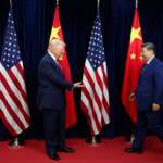 U.S. President Donald Trump extends his hand to greet Chinese President Xi Jinping, on the day of a bilateral meeting at Gimhae International Airport on the sidelines of the Asia-Pacific Economic Cooperation (APEC) summit in Busan, South Korea, on October 30, 2025. REUTERS/Evelyn Hockstein
