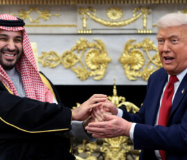 U.S. President Donald Trump and Saudi Crown Prince and Prime Minister Mohammed bin Salman hold hands during a meeting in the Oval Office at the White House in Washington, D.C., U.S., November 18, 2025. REUTERS/Evelyn Hockstein