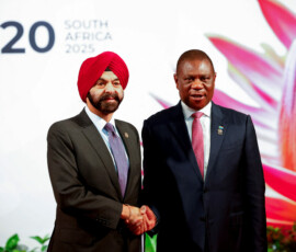 South African Deputy President Paul Mashatile welcomes World Bank President Ajay Banga on the opening day of the G20 Summit at the Nasrec Expo Centre in Johannesburg, South Africa, November 22, 2025. REUTERS/Thomas Mukoya/Pool