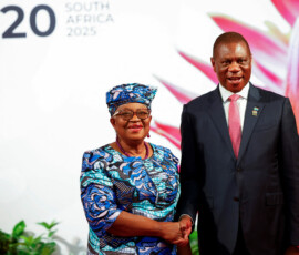 South African Deputy President Paul Mashatile welcomes World Trade Organization Director-General Ngozi Okonjo-Iweala on the opening day of the G20 Summit at the Nasrec Expo Centre in Johannesburg, South Africa, November 22, 2025. REUTERS/Thomas Mukoya/Pool