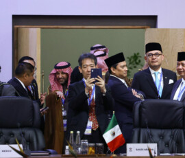 Delegates wait for the start of the plenary meeting, on the opening day of the G20 Summit at the Nasrec Expo Centre in Johannesburg, South Africa, November 22, 2025. REUTERS/Yves Herman