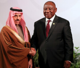 South African President Cyril Ramaphosa welcomes Saudi Arabia's Foreign Minister Faisal bin Farhan Al Saud at the Johannesburg Expo Centre for the G20 Leaders' Summit, Johannesburg, South Africa, 22 November 2025, for the Group of Twenty (G20) Leaders' Summit. Halden Krog/Pool via REUTERS
