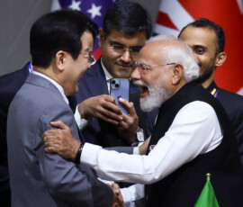 India's Prime Minister Narendra Modi reacts with South Korea's President Lee Jae Myung as they attend a plenary session on the first day of the G20 Leaders' Summit at the Nasrec Expo Centre in Johannesburg, South Africa, November 22, 2025. REUTERS/Yves Herman