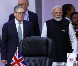 British Prime Minister Keir Starmer and India's Prime Minister Narendra Modi attend a plenary session on the first day of the G20 Leaders' Summit at the Nasrec Expo Centre in Johannesburg, South Africa, November 22, 2025. REUTERS/Yves Herman