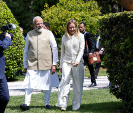Italy's Prime Minister Giorgia Meloni and Indian Prime Minister Narendra Modi arrive to plant a mulberry tree at Villa Doria Pamphili garden, in Rome, Italy, May 20, 2026. REUTERS/Remo Casilli