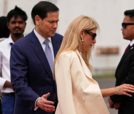 U.S. Secretary of State Marco Rubio and his wife Jeanette move to board their plane for New Delhi at Netaji Subhash Chandra Bose International Airport in Kolkata, India, Saturday, May 23, 2026. Julia Demaree Nikhinson/Pool via REUTERS