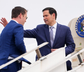 U.S. Secretary of State Marco Rubio waves as he boards his plane for New Delhi with the U.S. Ambassador to India Sergio Gor at Netaji Subhash Chandra Bose International Airport in Kolkata, India, Saturday, May 23, 2026. Julia Demaree Nikhinson/Pool via REUTERS