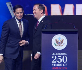 U.S Secretary of State Marco Rubio, is greeted by U.S. Ambassador to India Sergio Gor, as he arrives on stage to speak at an event celebrating the United States' 250th anniversary, at the Bharat Mandapam convention center, in New Delhi, India, Sunday, May 24, 2026. Julia Demaree Nikhinson/Pool via REUTERS
