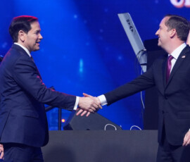U.S Secretary of State Marco Rubio, is greeted by U.S. Ambassador to India Sergio Gor, as he arrives on stage to speak at an event celebrating the United States' 250th anniversary, at the Bharat Mandapam convention center, in New Delhi, India, Sunday, May 24, 2026. Julia Demaree Nikhinson/Pool via REUTERS