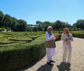 Italy's Prime Minister Giorgia Meloni and Indian Prime Minister Narendra Modi arrive to plant a mulberry tree at Villa Doria Pamphili garden, in Rome, Italy