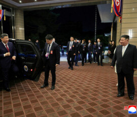 Chinese President Xi Jinping exits a vehicle with North Korean leader Kim Jong Un standing nearby, amid his state visit, in Pyongyang, North Korea, June 8, 2026, in this picture released by North Korea's official Korean Central News Agency. KCNA via REUTERS