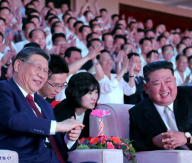Chinese President Xi Jinping sits next to North Korean leader Kim Jong Un as he attends a performance at the Pyongyang Indoor Stadium, during his state visit, in Pyongyang, North Korea, June 8, 2026, in this picture released by North Korea's official Korean Central News Agency. KCNA via REUTERS