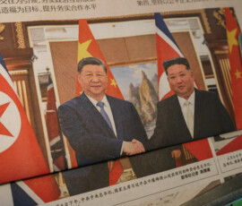 Newspapers with an image of Chinese President Xi Jinping shaking hands with North Korean leader Kim Jong Un during Xi's state visit to Pyongyang, North Korea, on the front page are displayed, at a news stand in Beijing, China June 9, 2026. REUTERS/Tingshu Wang