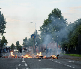 A fire burns during a protest after a knife attack on June 8 left a man seriously injured and prompted police to declare a critical incident, on Newtownards Road in Belfast, Northern Ireland, June 9, 2026. REUTERS/Isabel Infantes