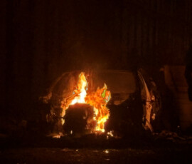 A car burns in east Belfast, during a protest after a knife attack on June 8 left a man seriously injured and prompted police to declare a critical incident, in Belfast, Northern Ireland, June 9, 2026. Picture taken wih a phone. REUTERS/Isabel Infantes