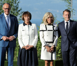 French President Emmanuel Macron and his wife Brigitte Macron pose for a picture with Germany's Chancellor Friedrich Merz and his wife, Charlotte Merz, during the G7 Summit in Evian-les-Bains, France, June 15, 2026. REUTERS/Christian Hartmann