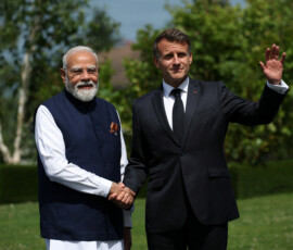 French President Emmanuel Macron and Indian Prime Minister Narendra Modi shake hands ahead of a family photo, on the sidelines of the G7 summit, in Evian-les-Bains, France, June 16, 2026. REUTERS/Isabel Infantes/Pool