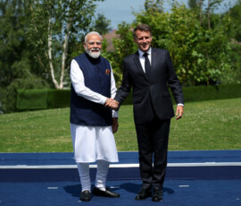 French President Emmanuel Macron and Indian Prime Minister Narendra Modi shake hands ahead of a family photo, on the sidelines of the G7 summit, in Evian-les-Bains, France, June 16, 2026. REUTERS/Isabel Infantes/Pool
