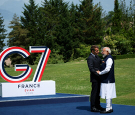 French President Emmanuel Macron and Indian Prime Minister Narendra Modi greet each other ahead of a family photo, on the sidelines of the G7 summit, in Evian-les-Bains in France, June 16, 2026. REUTERS/Isabel Infantes/Pool TPX IMAGES OF THE DAY