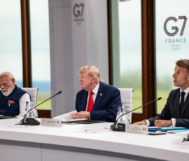 Indian Prime Minister Narendra Modi, U.S. President Donald Trump and French President Emmanuel Macron attend a working session with G7 leaders and outreach partners on international investment partnerships during the G7 Summit in Evian-les-Bains, France, June 16, 2026. REUTERS/Evelyn Hockstein