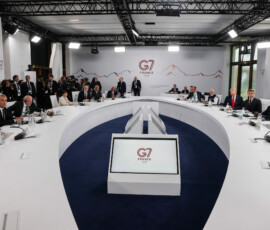 U.S. President Donald Trump, French President Emmanuel Macron, Canadian Prime Minister Mark Carney, Italian Prime Minister Giorgia Meloni, Japanese Prime Minister Sanae Takaichi, European Council President Antonio Costa, German Chancellor Friedrich Merz, India's Prime Minister Narendra Modi, Brazilian President Luiz Inacio Lula da Silva, Kenya's President William Ruto and British Prime Minister Keir Starmer attend a working session with G7 leaders and outreach partners on international investment partnerships during the G7 Summit in Evian-les-Bains, France, June 16, 2026. REUTERS/Christian Hartmann