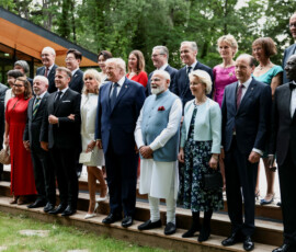 Italy's Prime Minister Giorgia Meloni, European Council President Antonio Costa, Ukraine's President Volodymyr Zelenskiy, Caroline Merotto, wife of Switzerland's President Guy Parmelin, Japan's Prime minister Sanae Takaichi, Swiss Federal President Guy Parmelin, Brazil's Rosangela "Janja" da Silva, Brazil's President Luiz Inacio Lula da Silva, South Korea's President Lee Jae-myung, France's President Emmanuel Macron, South Korea's first lady Kim Hea Kyung, French President's wife Brigitte Macron, British Prime Minister's wife Victoria Starmer, U.S. President Donald Trump, Britain's Prime Minister Keir Starmer, India's Prime Minister Narendra Modi, Canada's Prime Minister Mark Carney, Canadian Prime Minister's wife Diana Carney, European Commission President Ursula von der Leyen, German Chancellor's wife Charlotte Merz, European Commission President's husband Heiko von der Leyen, , Germany's Chancellor Friedrich Merz and Kenya's President William Ruto pose for a family photo before a cultural performance and concert during the G7 summit, in Evian-les-Bains, France, June 16, 2026. REUTERS/Evelyn Hockstein