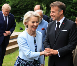 France's President Emmanuel Macron holds hands with European Commission President Ursula von der Leyen after posing for a family photo prior to a gala dinner as part of the G7 summit in Evian-les-Bains, France, June 16, 2026. Ludovic Marin/Pool via REUTERS