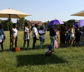 Parents stand in the shade as they watch a sports day event at the Harris Academy Primary Mayflower school, as Britain experiences record temperatures disrupting schools and transport networks, in Grays, Britain, June 24, 2026. REUTERS/Jack Taylor
