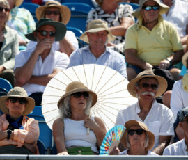 Tennis - Eastbourne Open - Devonshire Park Lawn Tennis Club, Eastbourne, Britain - June 24, 2026 General view of spectators in the stands amidst the heatwave as they take cover under hats during the round of 16 match between Latvia's Jelena Ostapenko and Hungary's Panna Udvardy REUTERS/Isabel Infantes