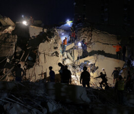 Emergency services work at the site of a collapsed building after an earthquake, in Caracas, Venezuela, June 24, 2026. REUTERS/Gaby Oraa TPX IMAGES OF THE DAY