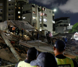Police officers and rescuers work at the site of damaged buildings in the aftermath of an earthquake, in Caracas, Venezuela, June 24, 2026. REUTERS/Fausto Torrealba