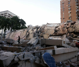 Emergency services work at the site of a collapsed building after earthquakes hit the country, in Caracas, Venezuela, June 25, 2026. REUTERS/Leonardo Fernandez Viloria