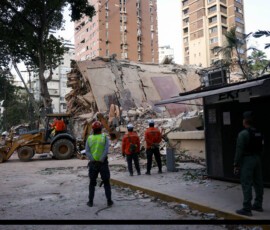 Emergency services work at the site of a collapsed building after earthquakes hit the country, in Caracas, Venezuela, June 25, 2026. REUTERS/Leonardo Fernandez Viloria