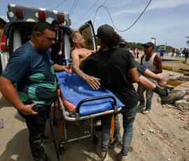 An injured man is laid on a stretcher in the aftermath of earthquakes in La Guaira, Venezuela, June 25, 2026. REUTERS/Maxwell Briceno
