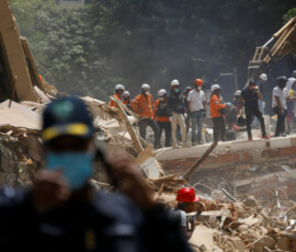 Emergency services work at the site of a collapsed building after earthquakes hit the country, in Caracas, Venezuela, June 25, 2026. REUTERS/Fausto Torrealba
