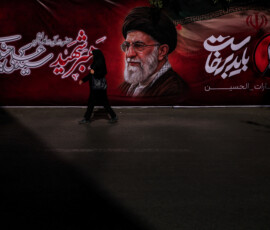A woman walks past a banner depicting Iran's late Supreme Leader Ayatollah Ali Khamenei, who was killed on February 28 in Israeli and U.S. airstrikes, near the Imam Khomeini Grand Mosalla, in Tehran, Iran July 3, 2026. REUTERS/Alkis Konstantinidis Foreign media in Iran operate under guidelines set by the Ministry of Culture and Islamic Guidance, which regulates press activity and permissions ISRAEL OUT. NO COMMERCIAL OR EDITORIAL SALES IN ISRAEL. NO ACCESS FOR ISRAELI MEDIA. NO USE BBC PERSIAN. NO USE VOA PERSIAN. NO USE MANOTO. NO USE IRAN INTERNATIONAL. NO USE RADIO FARDA. DIGITAL: NO USE BBC PERSIAN. NO USE VOA PERSIAN. NO USE MANOTO. NO USE IRAN INTERNATIONAL. NO USE RADIO FARDA. TPX IMAGES OF THE DAY