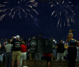 People watch Macy's Fourth of July fireworks as the United States celebrates its 250th anniversary on Independence Day in New York City, U.S., July 4, 2026. REUTERS/Shannon Stapleton