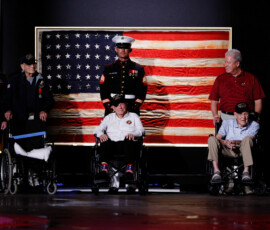 U.S. veterans join President Donald Trump on stage during a Fourth of July rally, marking the 250th anniversary of U.S. independence, on the National Mall in Washington, D.C., U.S., July 4, 2026. REUTERS/Evan Vucci