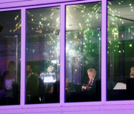 U.S. President Donald Trump looks at his mobile phone as fireworks explode during the Freedom 250's Salute to America as the United States celebrates its 250th anniversary on Independence Day, attempting the largest firework display in history with 850,000 fireworks in Washington, D.C., U.S., July 5, 2026. REUTERS/Jonathan Ernst