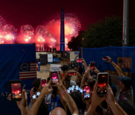 People watch a fireworks display during the Freedom 250's Salute to America as the United States celebrates its 250th anniversary on Independence Day, attempting the largest firework display in history with 850,000 fireworks in Washington, D.C., U.S., July 5, 2026. REUTERS/Cheney Orr