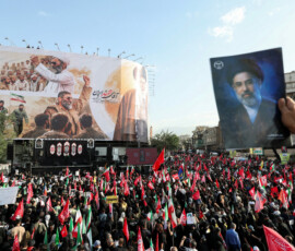 A mourner holds an image of Iran's Supreme Leader Mojtaba Khamenei as people gather for a funeral procession for Iran's late Supreme Leader Ayatollah Ali Khamenei, who was killed on February 28 in Israeli and U.S. airstrikes, in Tehran, Iran, July 6, 2026. REUTERS/Mohammed Salem