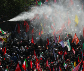 Water is sprayed as mourners gather on the day of a funeral procession for Iran's late Supreme Leader Ayatollah Ali Khamenei, who was killed on February 28 in Israeli and U.S. airstrikes, in Tehran, Iran, July 6, 2026. REUTERS/Murad Sezer
