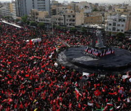 Mourners gather around a monument in the form of a raised fist of the deceased supreme leader of Iran, Ayatollah Ali Khamenei, in Enghelab Square, during a funeral procession for Khamenei, who was killed on February 28 in Israeli and U.S. airstrikes, in Tehran, Iran, July 6, 2026. REUTERS/Murad Sezer